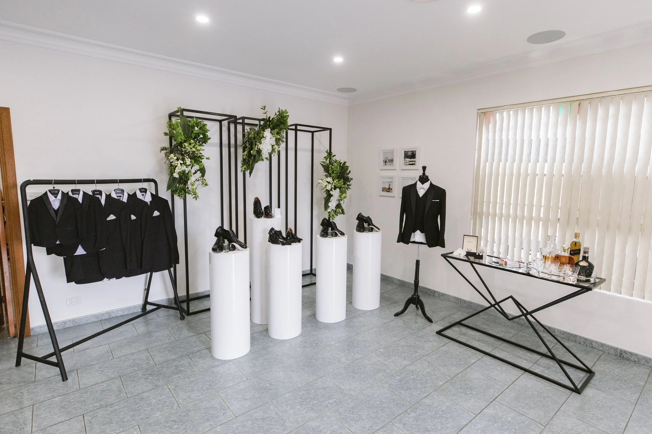 Grooms suit and accessories styled for photos the morning of the wedding