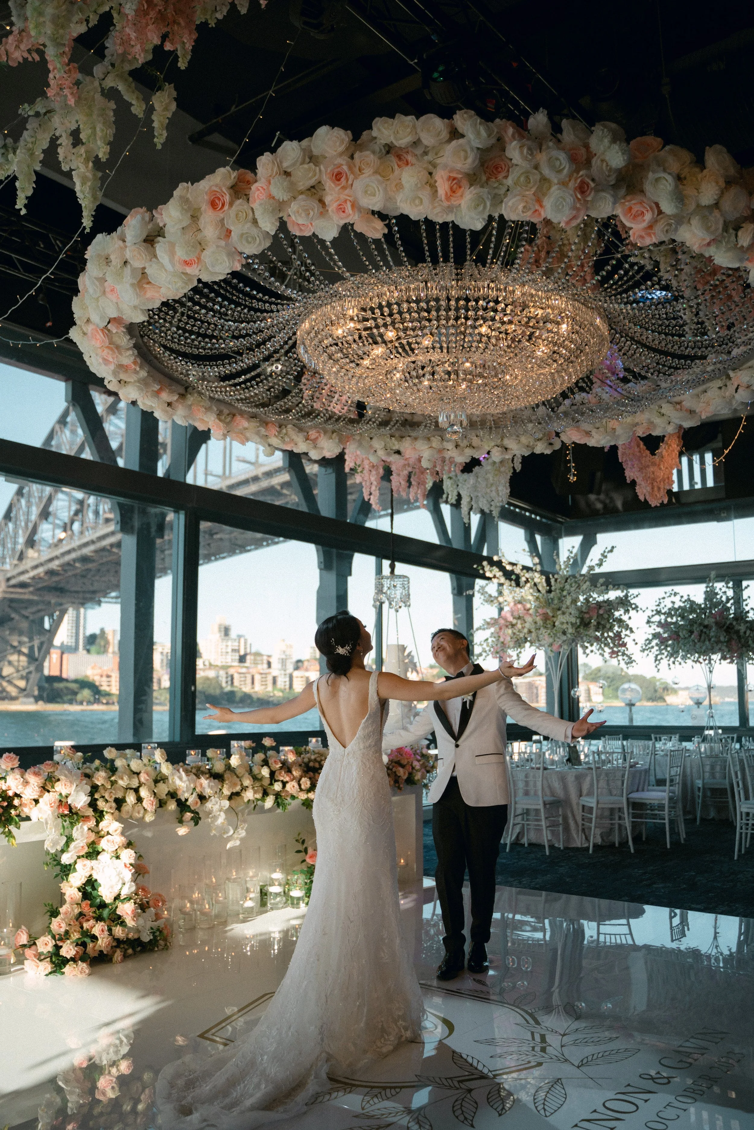 Bride and groom embrace their beautifully styled sydney reception during room reveal.