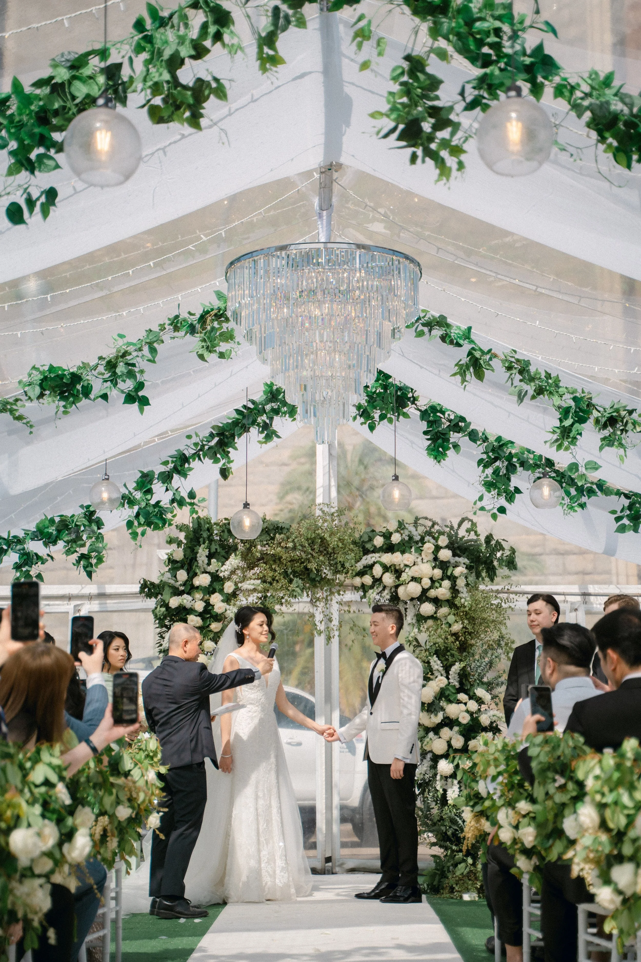 Couples exchanging vows with city skyline backdrop in Sydney