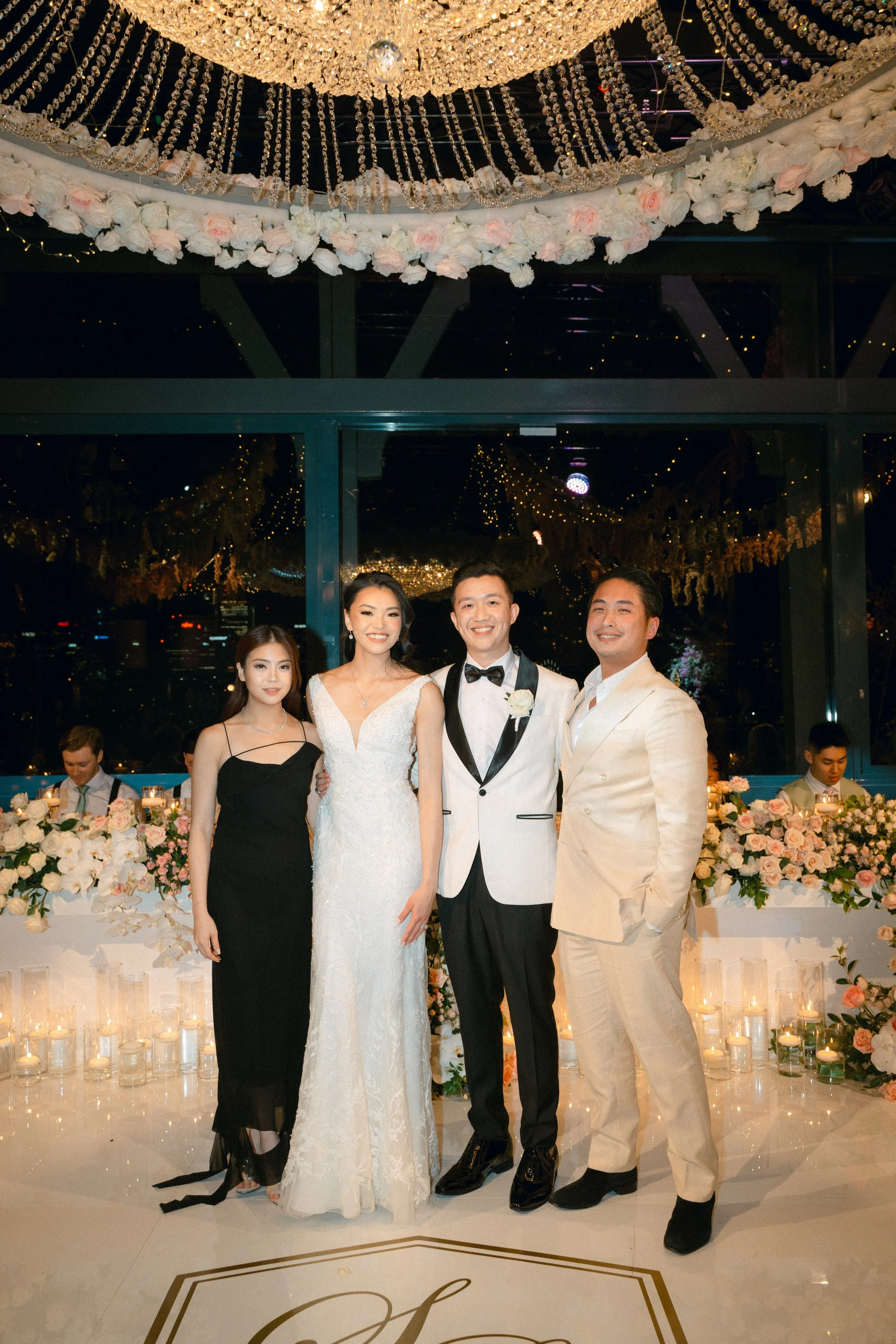 Bride and groom pose with maid of honour and Bestman for a memorable wedding portrait.