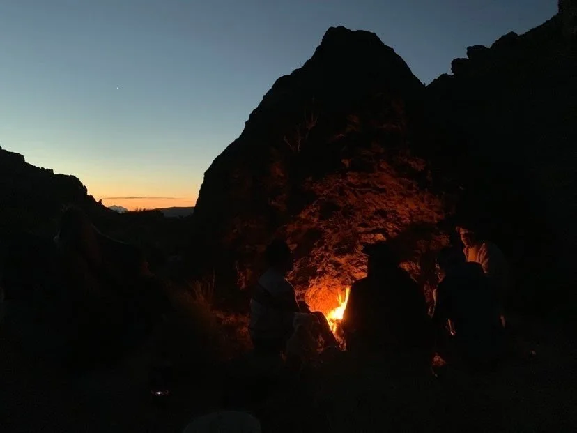Sharing stories with Julio around the fire, Mt. Tronador in the distance.