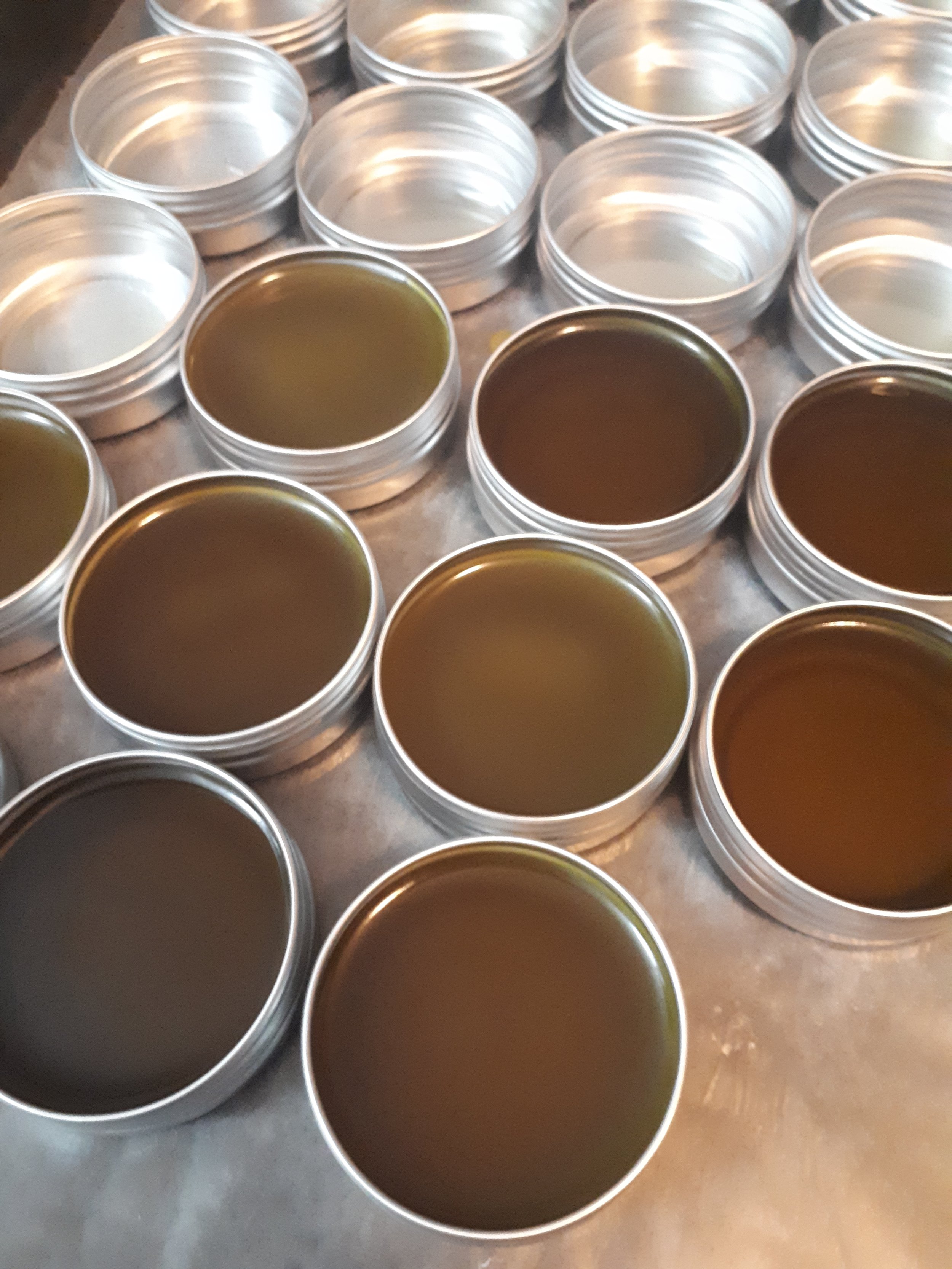 infused oils workshop -  salve blends solidifying into tins 13 Moons Booty Balm.jpg