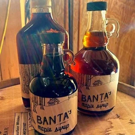 Bottles of Banta's Maple Syrups in the sunlight