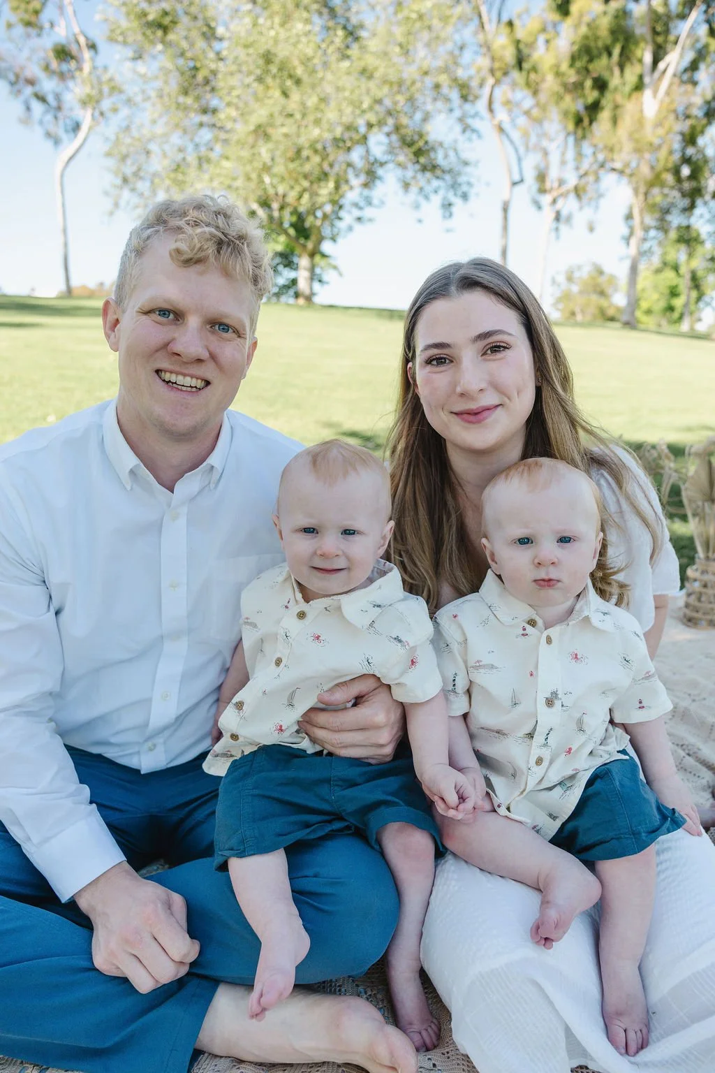 Dr. Derek and Dr. Caitlyn at the park with their twin boys