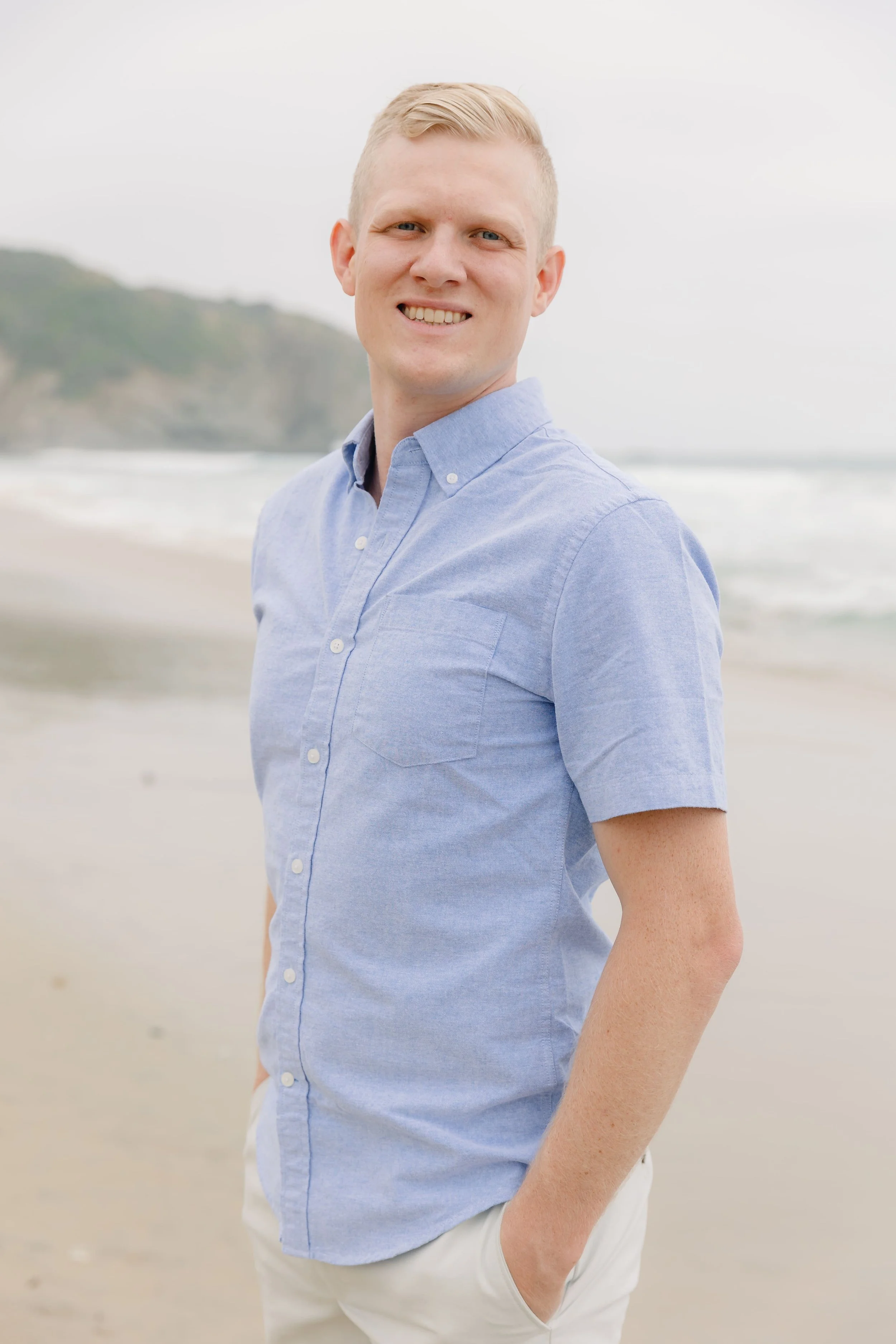 Dr. Derek standing on the beach