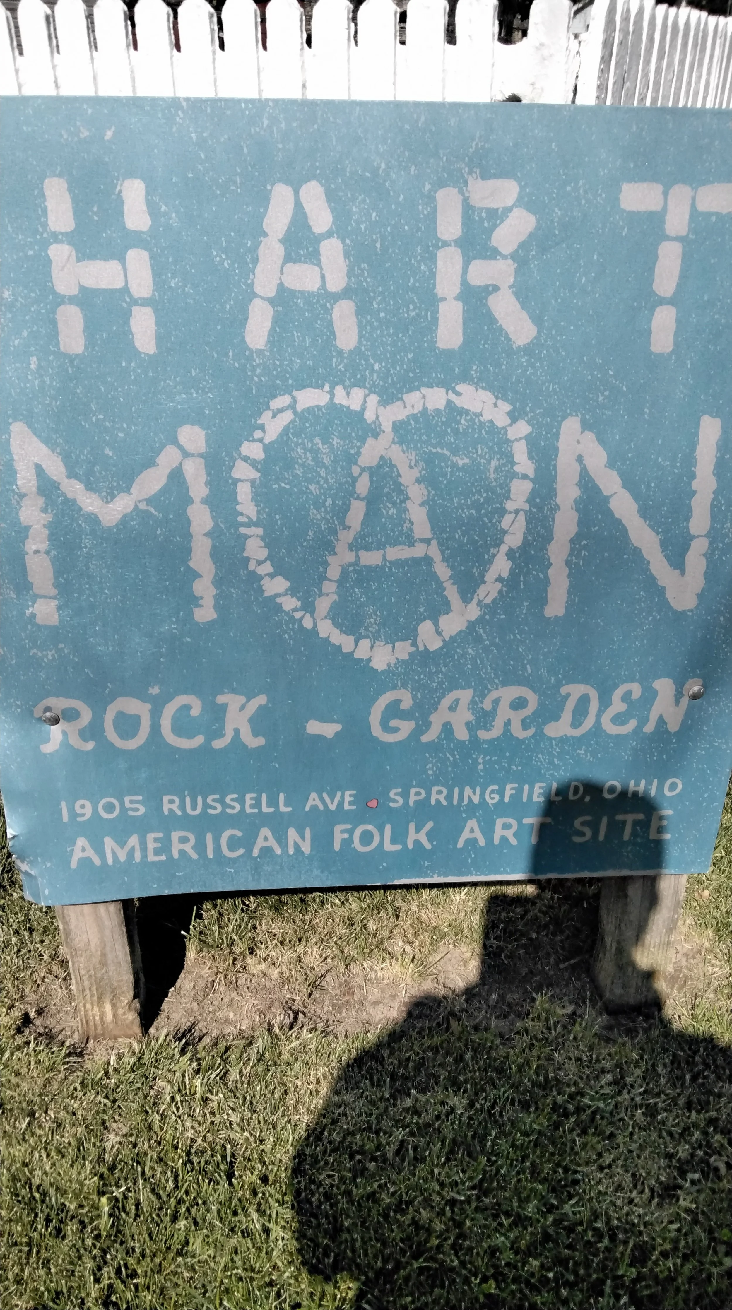 Sign for Hark-Main Rock Garden at 1905 Russell Ave, Springfield, Ohio. It is an American folk art site with a rock art style.