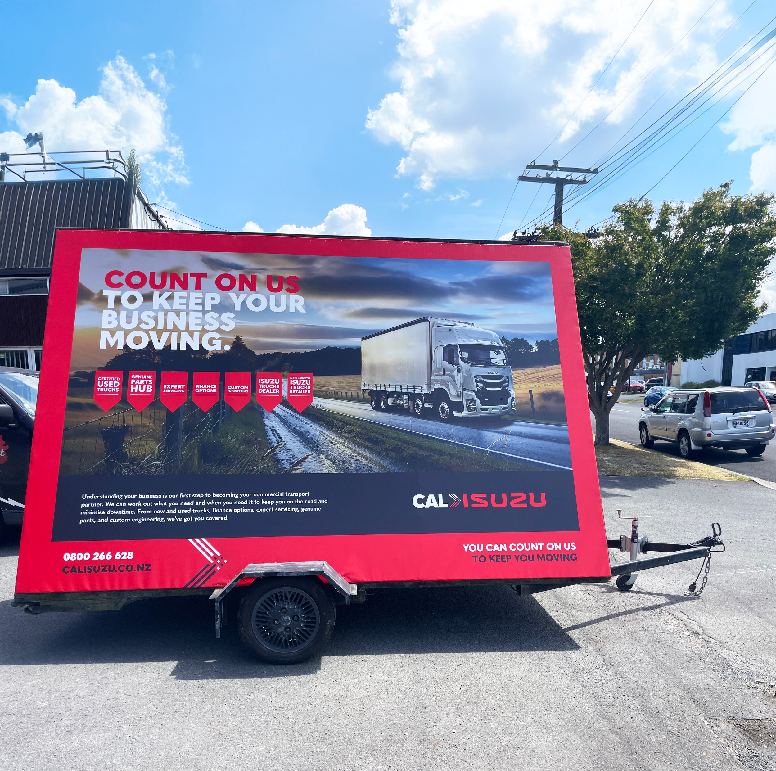 Cal Isuzu Ad trailer side.png