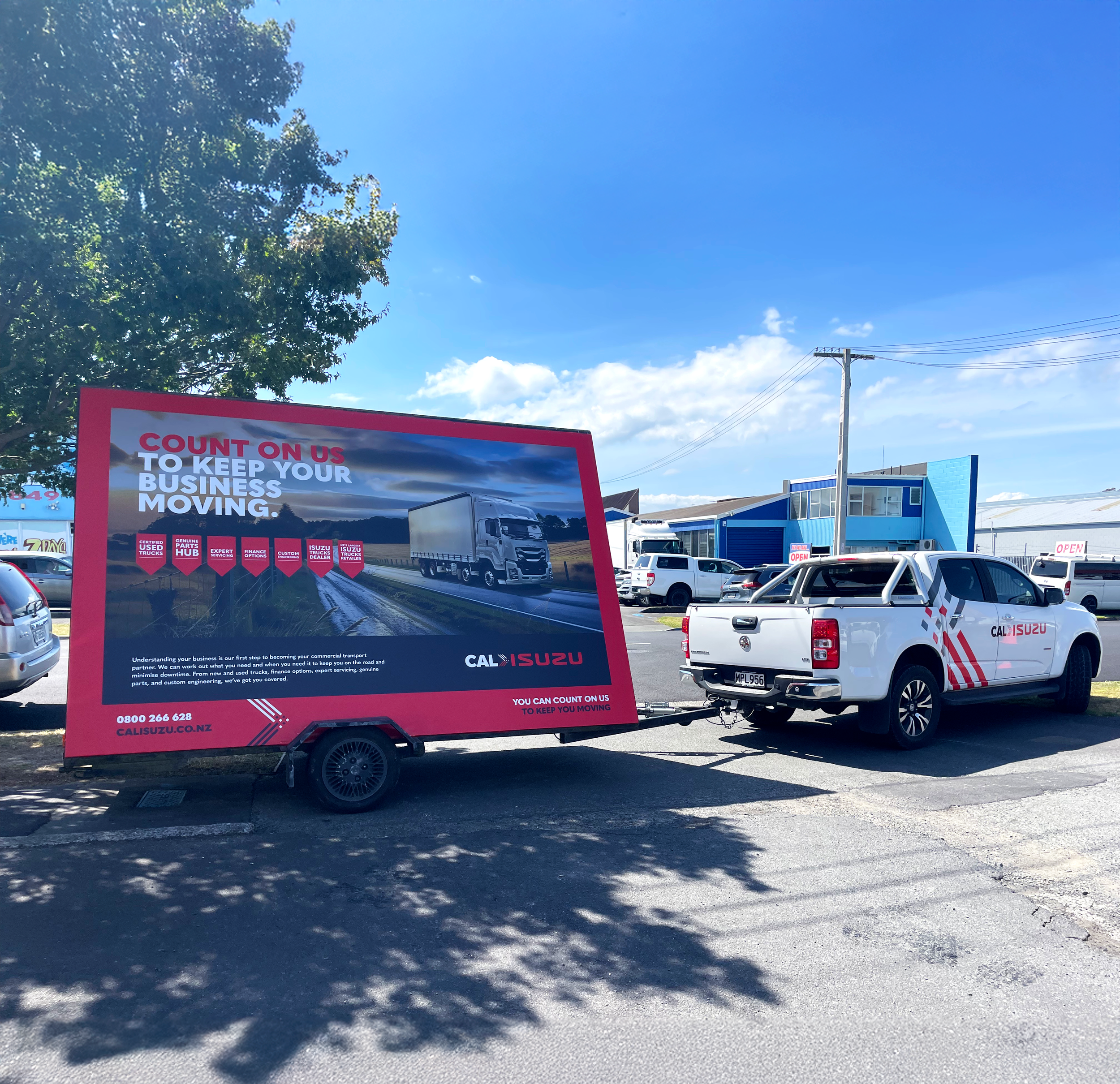 Cal Isuzu Ad trailer and ute 3.png