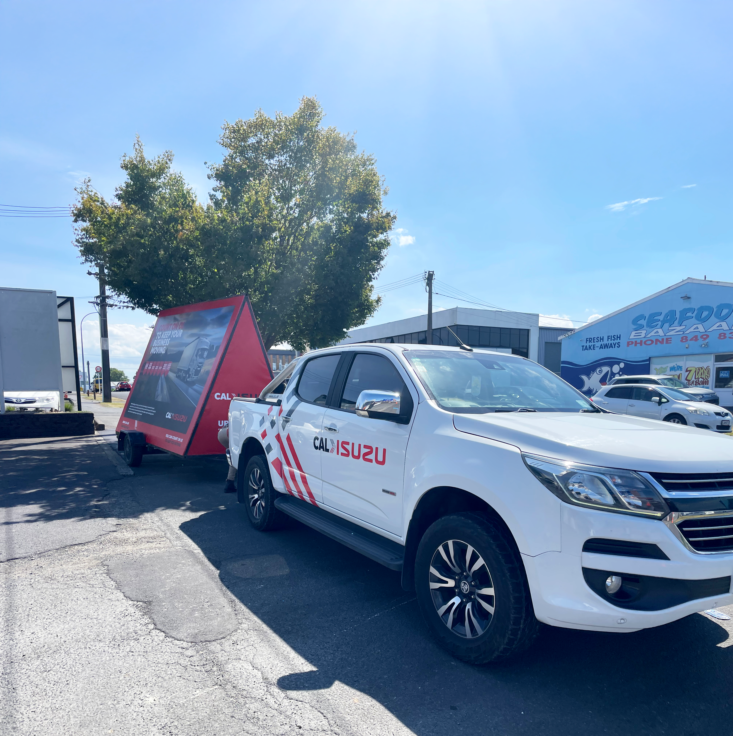 Cal Isuzu Ad trailer and ute.png