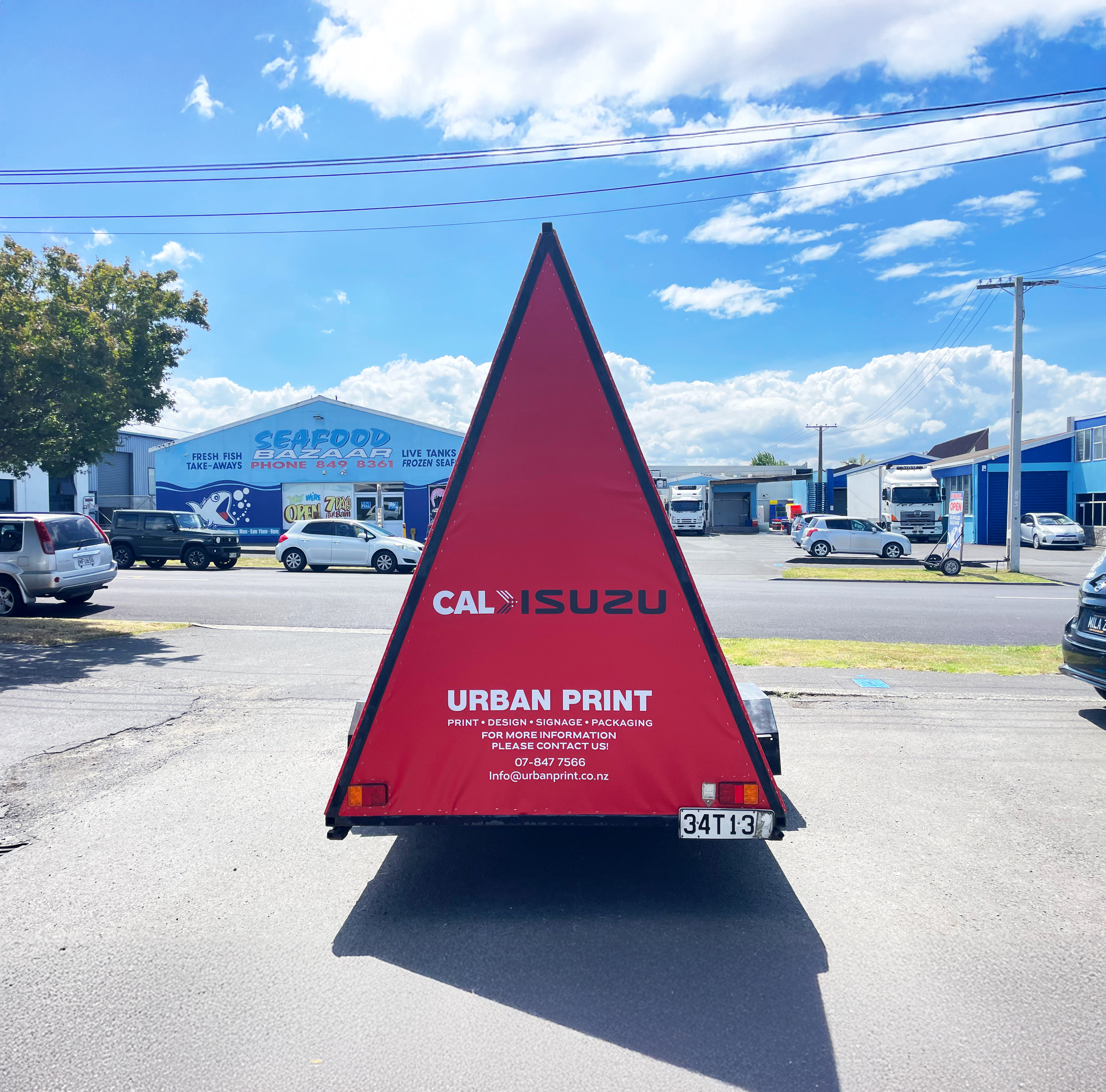 Cal Isuzu Ad trailer back.png