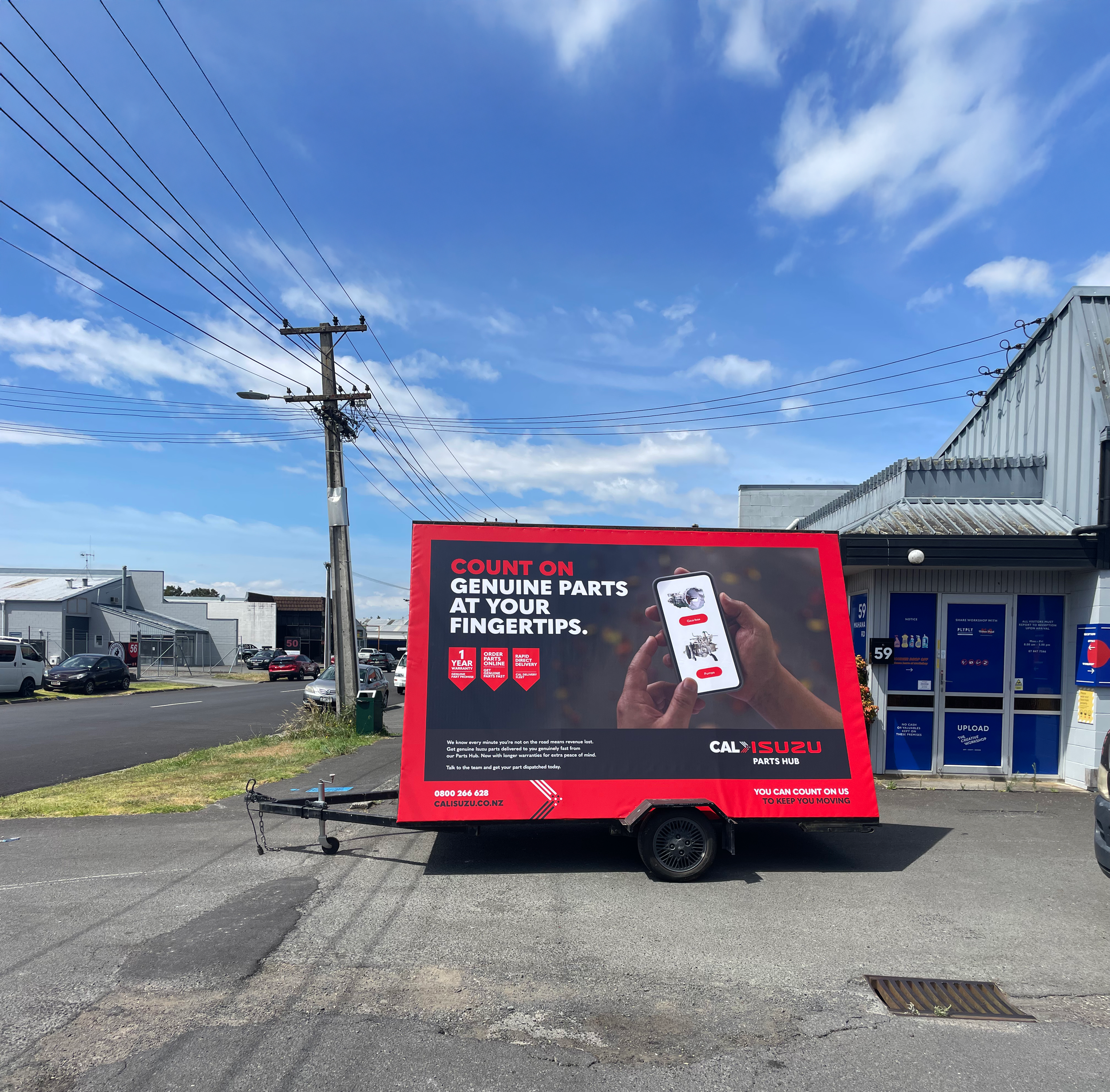 Cal Isuzu Ad trailer side 3.png