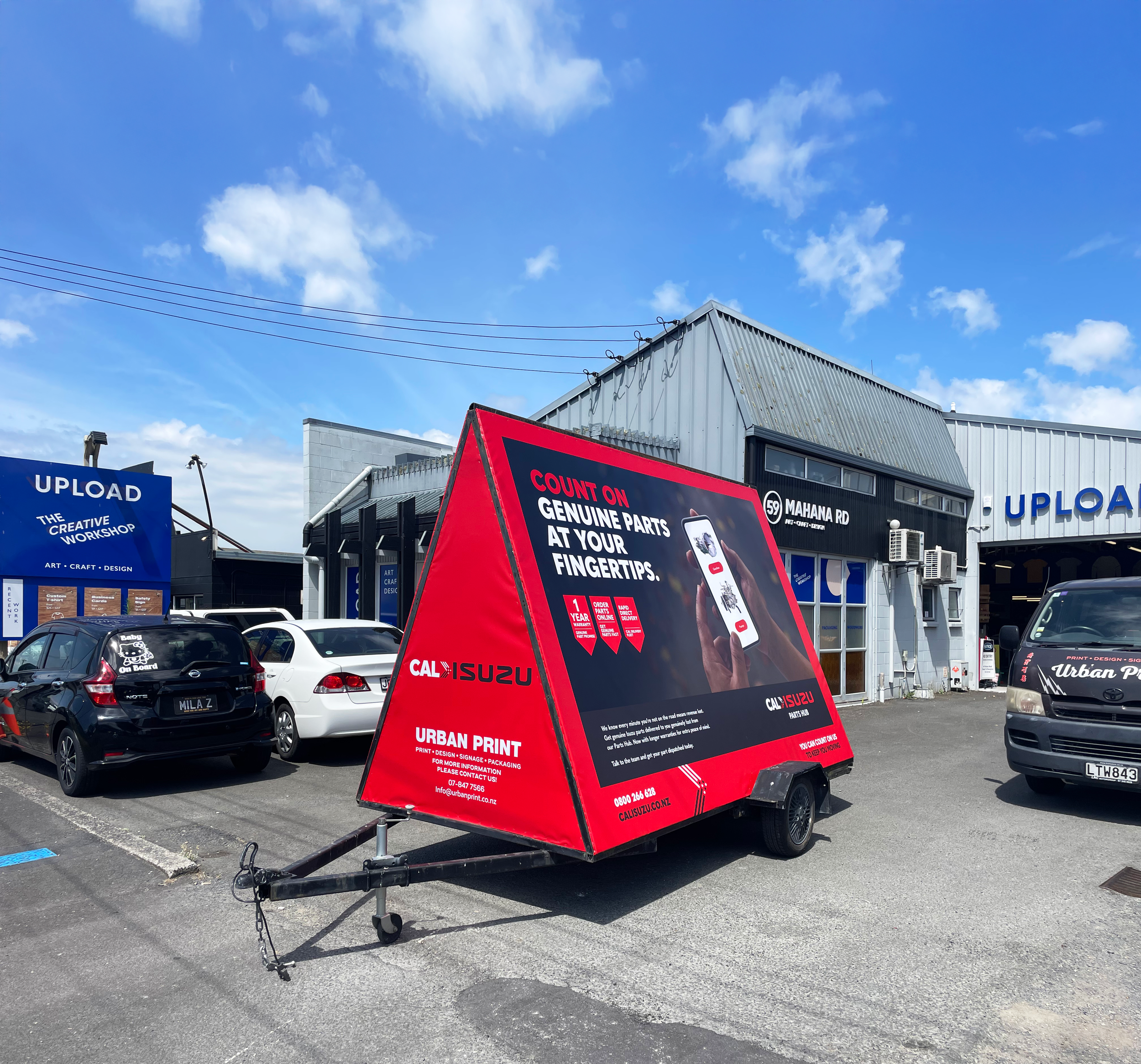 Cal Isuzu Ad trailer side front.png