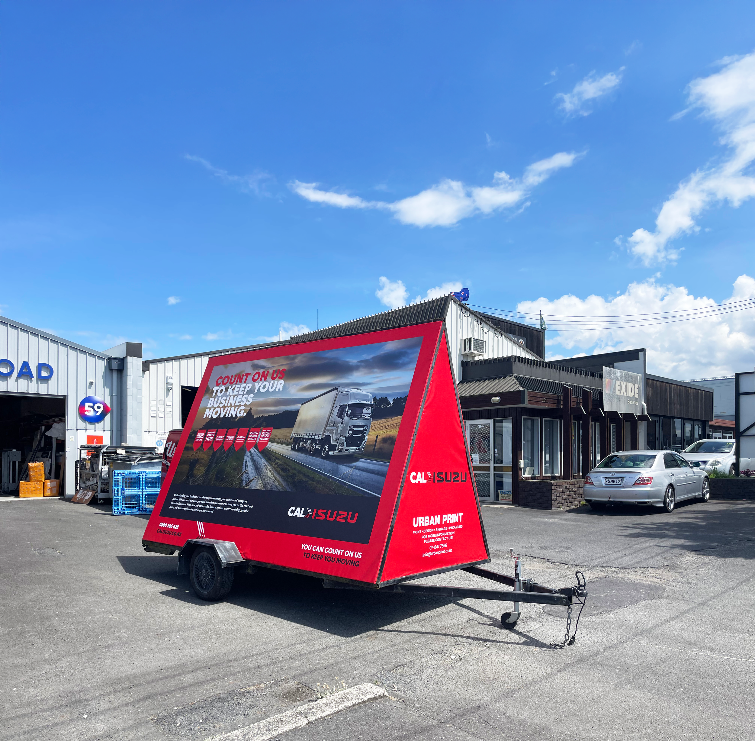 Cal Isuzu Ad trailer side 2.png