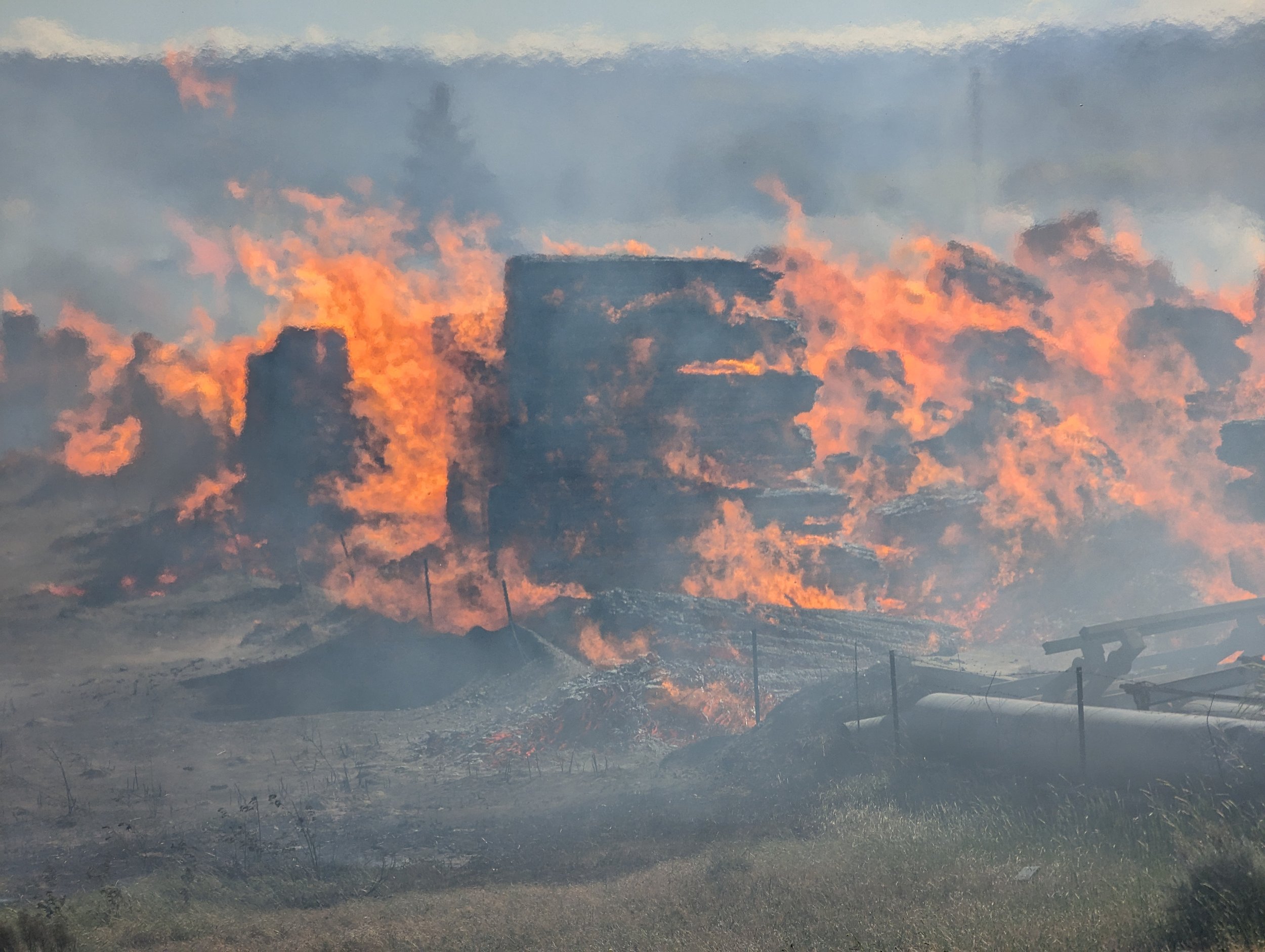 Burning lumber. Tidyman Road Fire, May 17, 2024