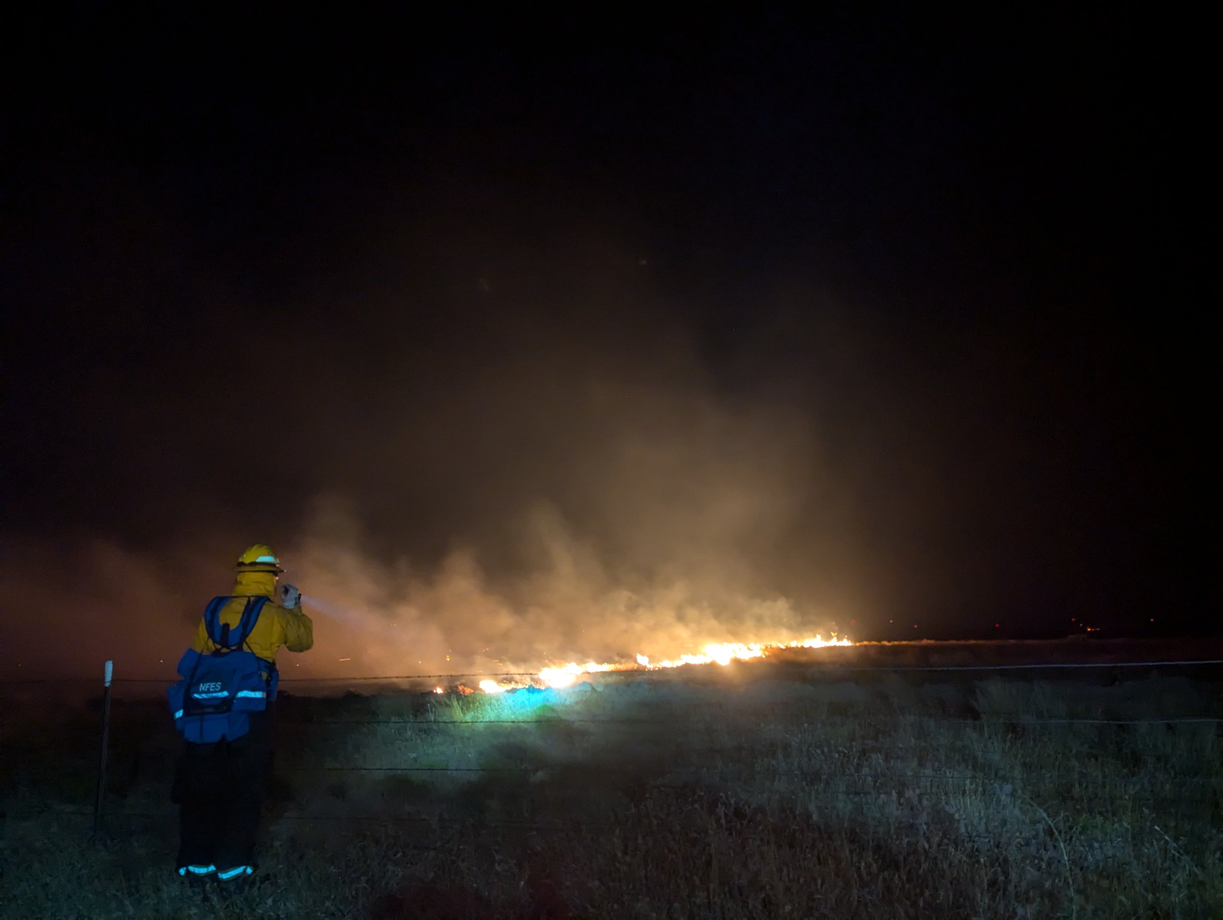 Volunteer Wright assessing fire behavior. Bighorn Fire, July 24, 2024