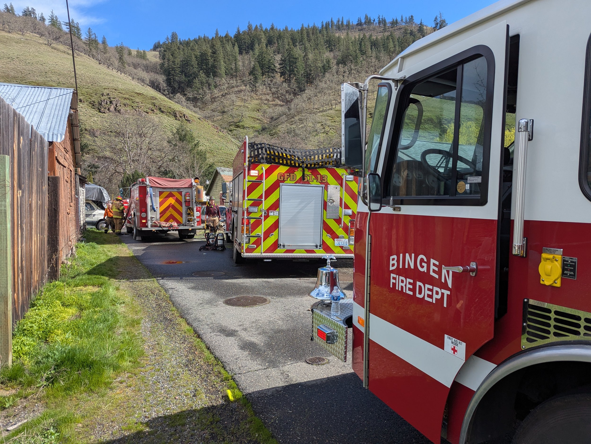 Klickitat firefighters and neighboring fire districts (including Bingen Fire Dept., shown here) assisting on a structure fire on Tin Can Alley in Klickitat. April 1, 2025