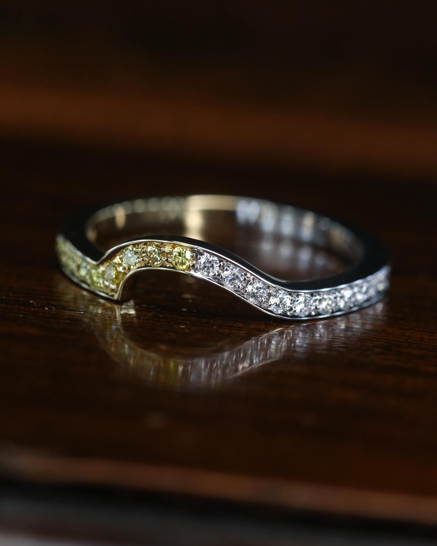 Super unique wedding band 💛🤍

Made to fit snug around a Toi et Moi engagement ring with a yellow and white diamond. 💍 

I designed this not only to mirror the white and yellow diamonds of the engagement ring but adding the two tone yellow and whit