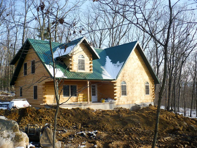 Baker custom log home with covered porch