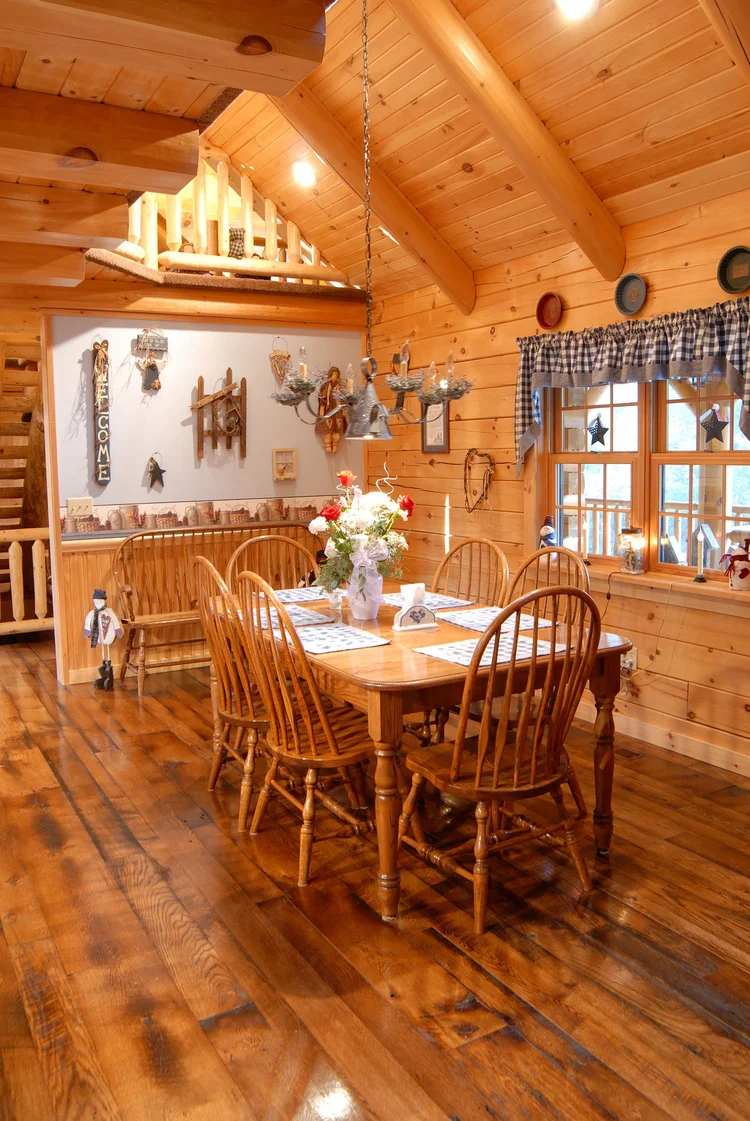Hicks log home side view with stone foundation