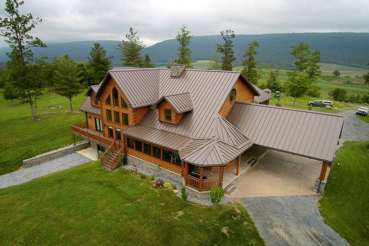 Standing seam metal roof on custom log home