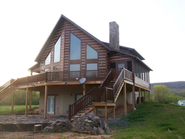 Conway log home front entry with covered portico