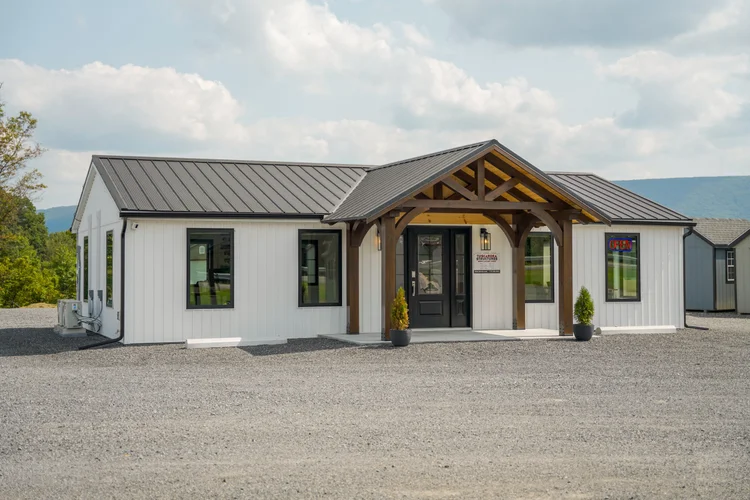 KSM Log Homes and Timber Packages sales office with custom timber-frame porch