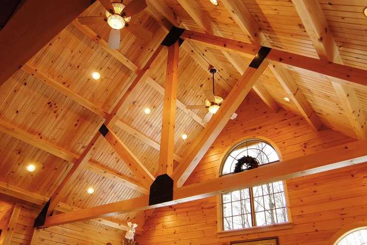 Beaver log home side view with attached garage