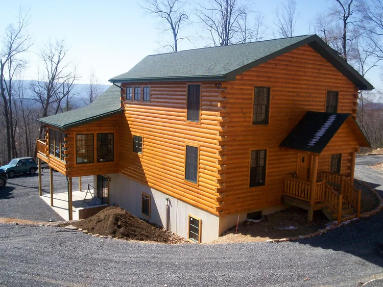 Marv Highlands log home on wooded hillside