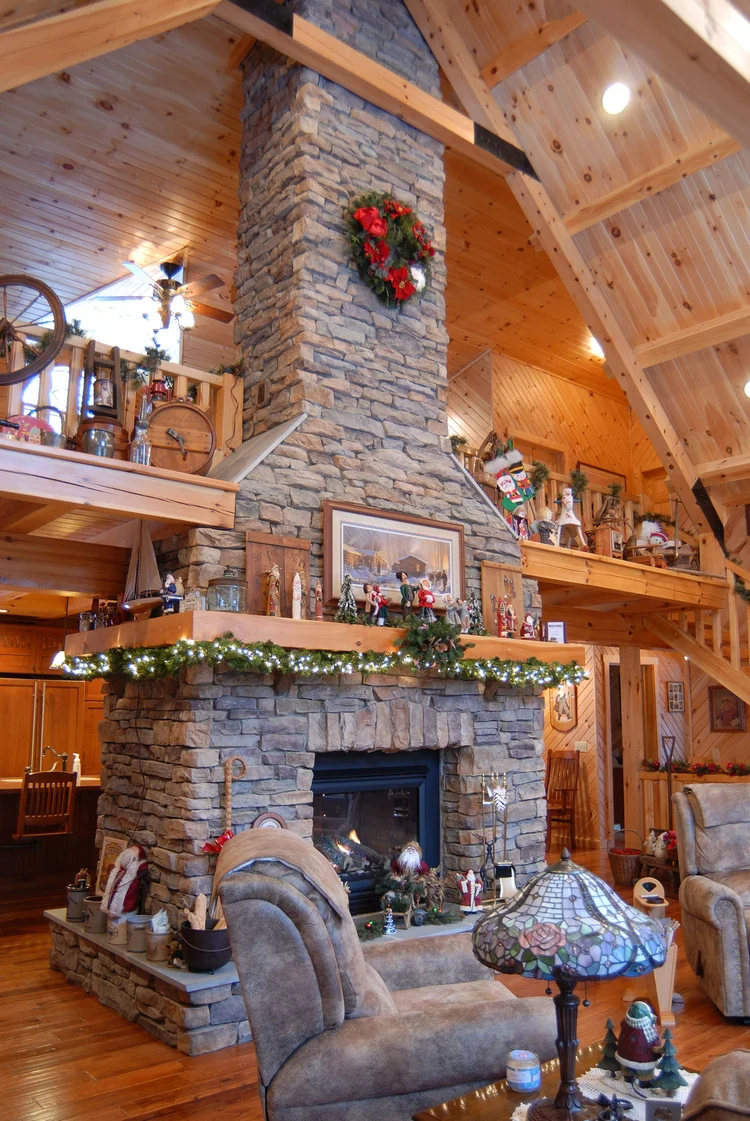 Beaver log home front with stone and log accents