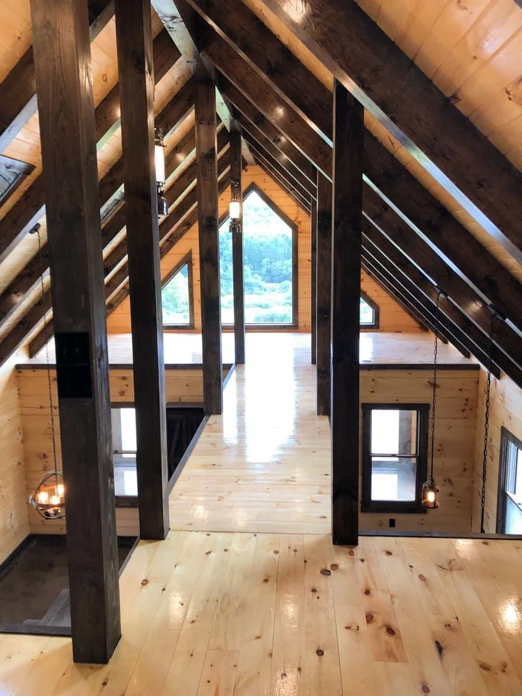 Paskovich log home interior with exposed log walls