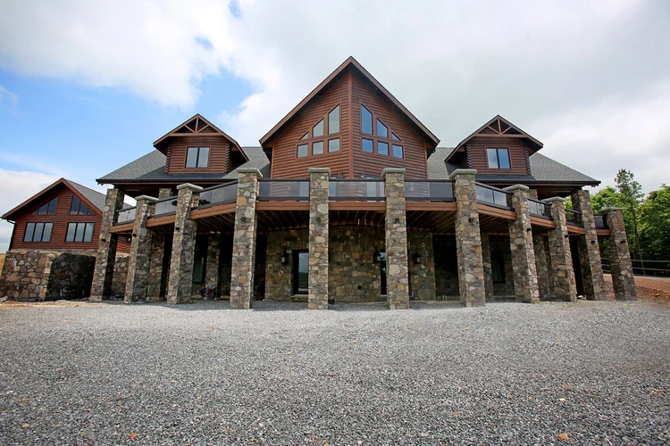 KSM showcase log home exterior with covered entry