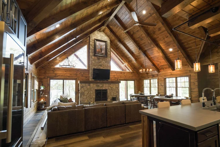 Open concept log home interior with vaulted ceilings