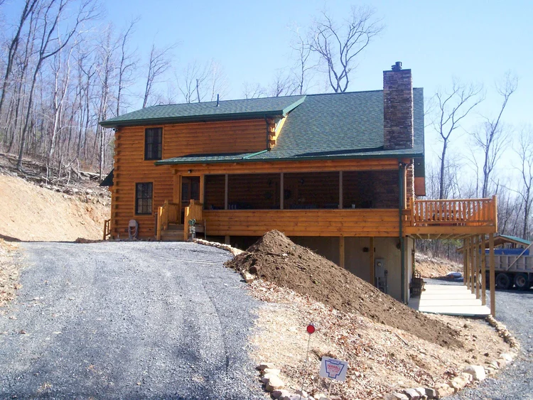 Marv Highlands log home front with metal roof