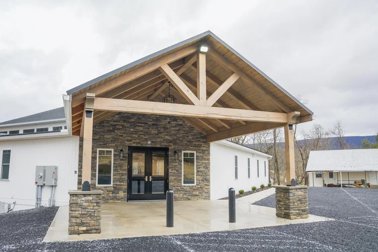 JCC timber-frame entry portico with heavy beams