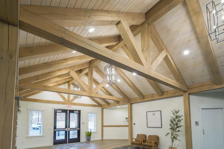 JCC timber-frame entry from an angle showing roof detail