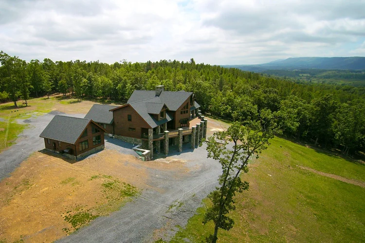 KSM showcase home nestled in wooded landscape