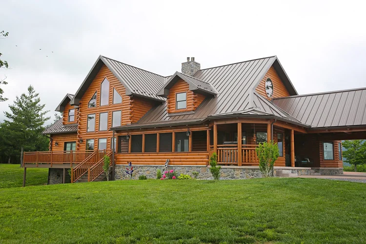 Large rear deck with screened-in porch on log home