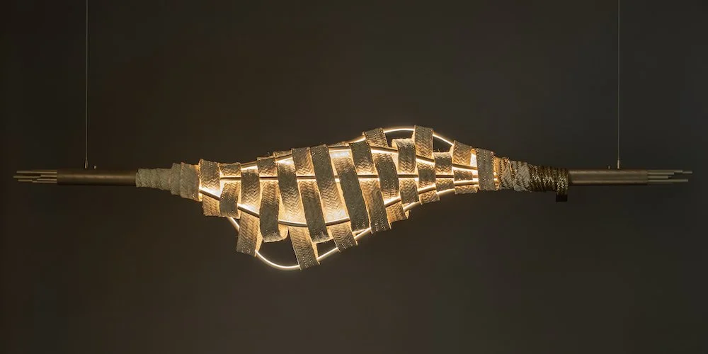 a suspended pendant light that celebrates the regional craft of ‘Safeefah’ (palm frond weaving). An unorthodox design produced in collaboration with Emirati craftswomen