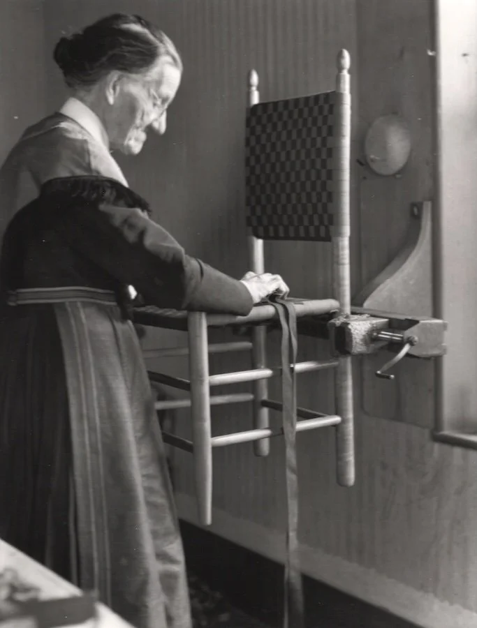 Sister Sarah Collins weaving a chair seat in her workroom, c. 1935-36 Collection of Hancock Shaker Village, photo: Noel Vincentini