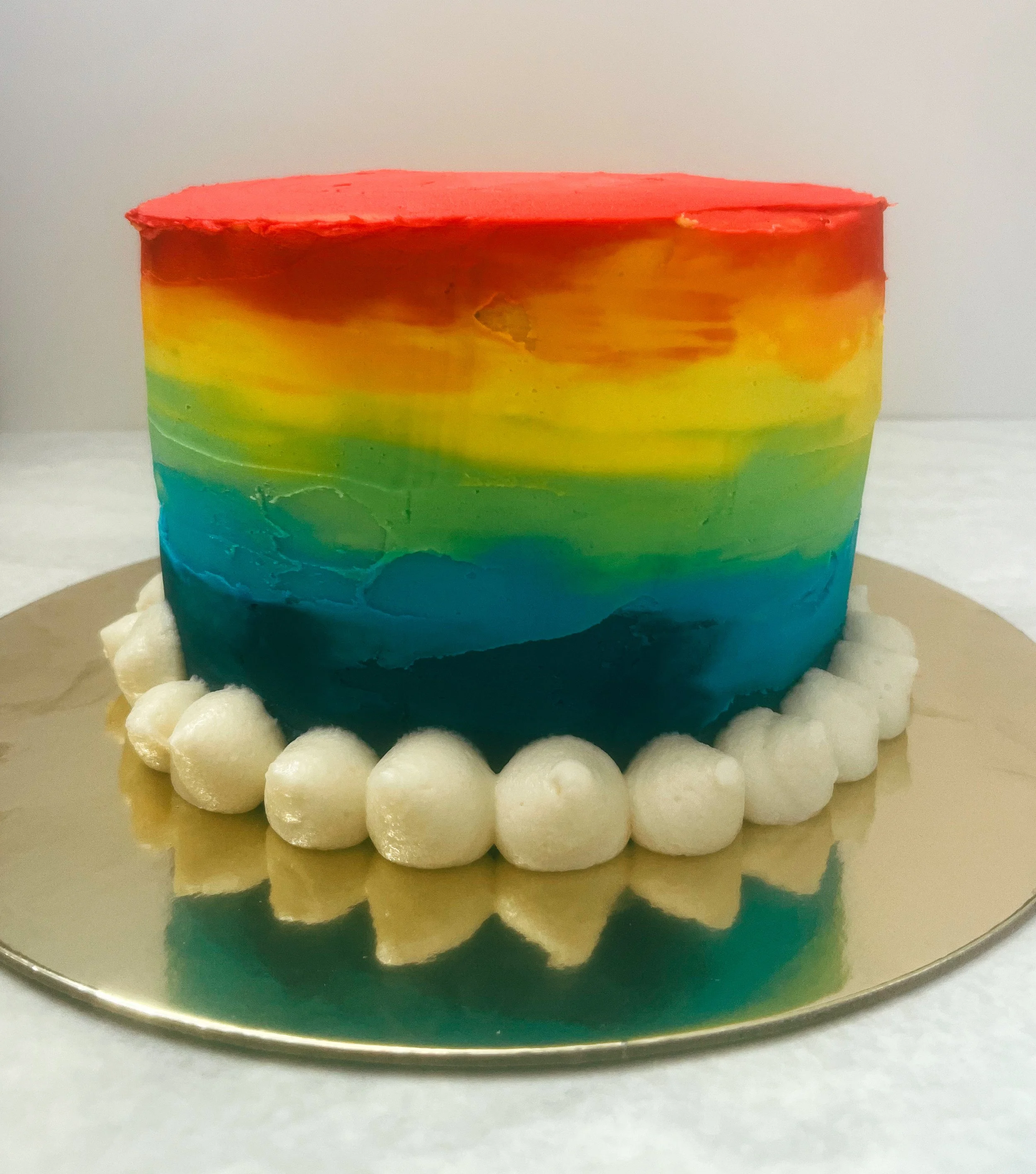 A colorful cake for a colorful first birthday!