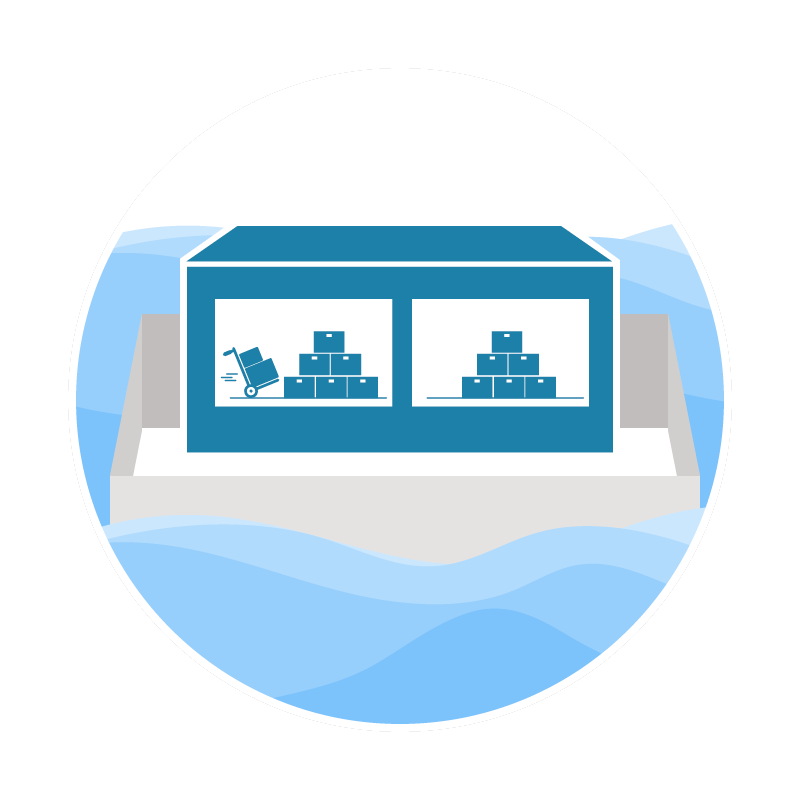 A polar bear enclosure with a blue structure containing stacked boxes and a wheelbarrow, surrounded by ice and water.