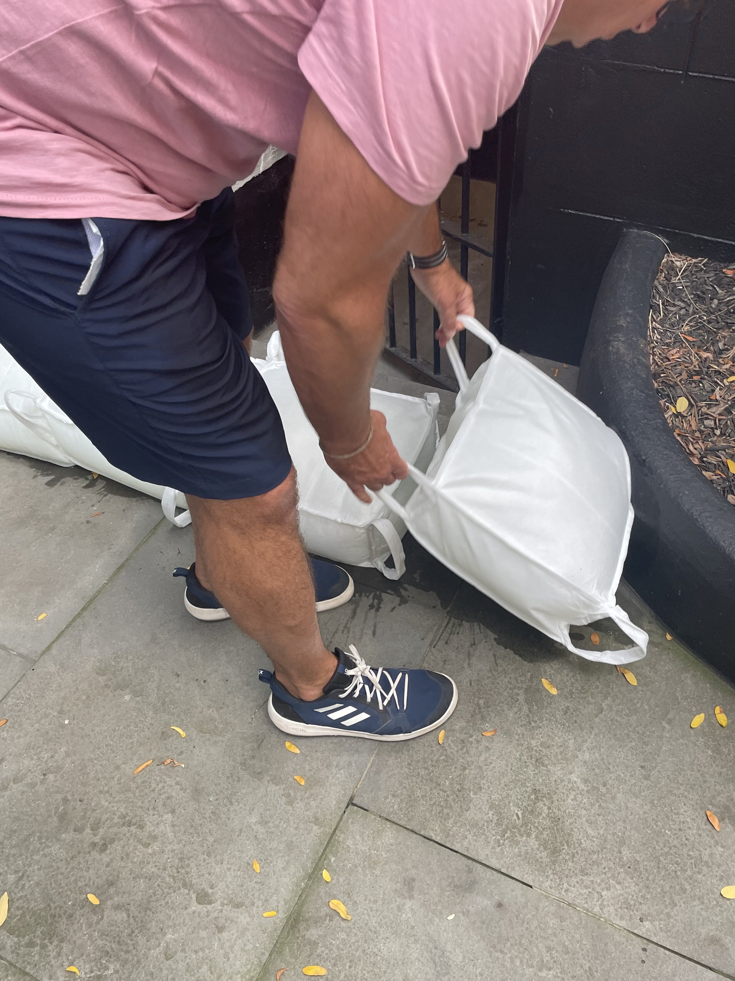 Placement of gel filled sandbags for flood control