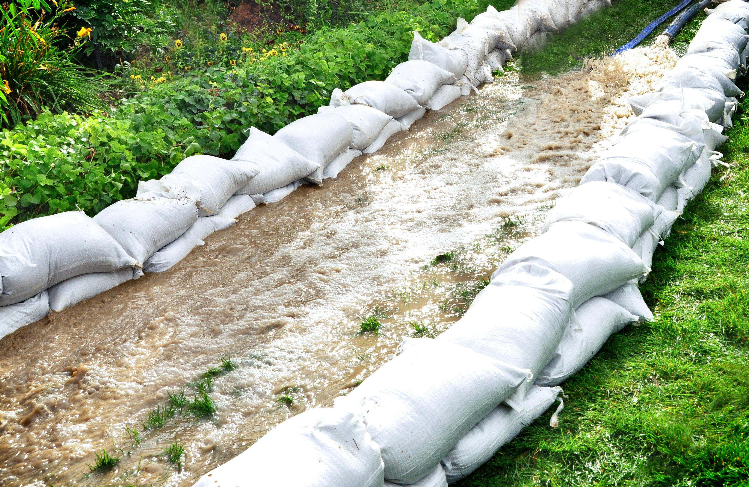 Sandbags for re-directing water floods