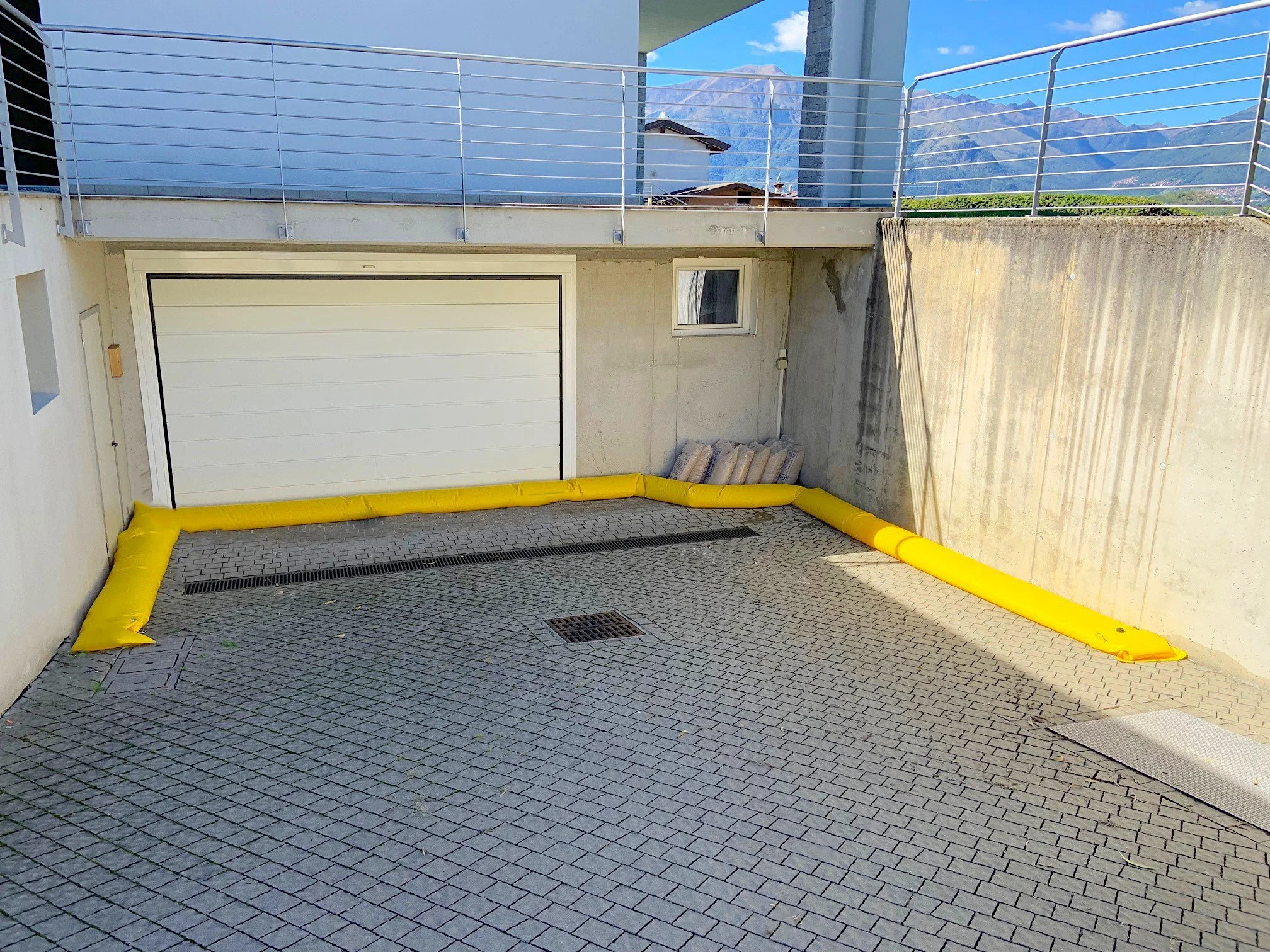 driveway and garage flood control tubes