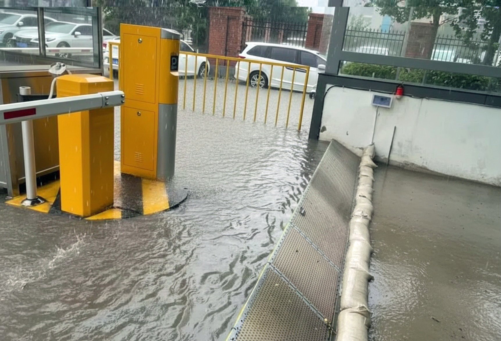 Floodwaters reaching parking ramp and stopped by Oyster flood barrier (Copy)