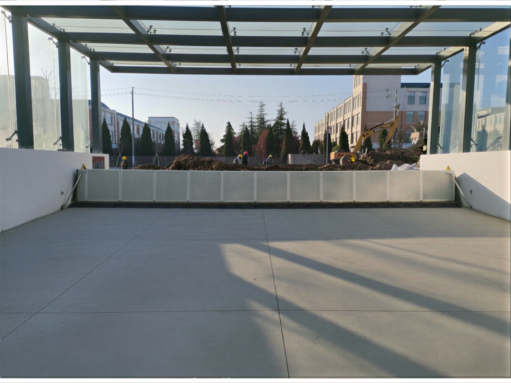 Hydrostatically rising flood barrier on garage ramp (Copy)
