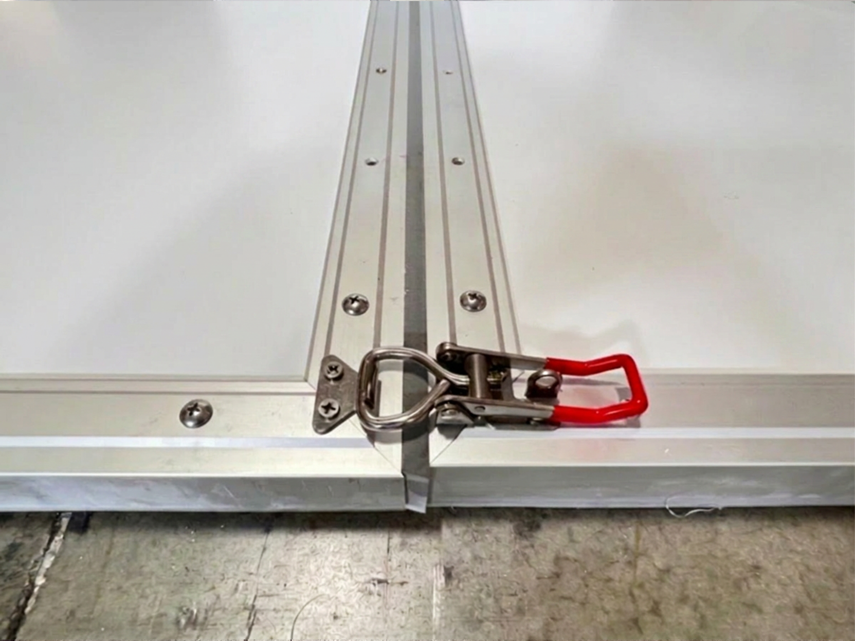 Front flood wall latch system