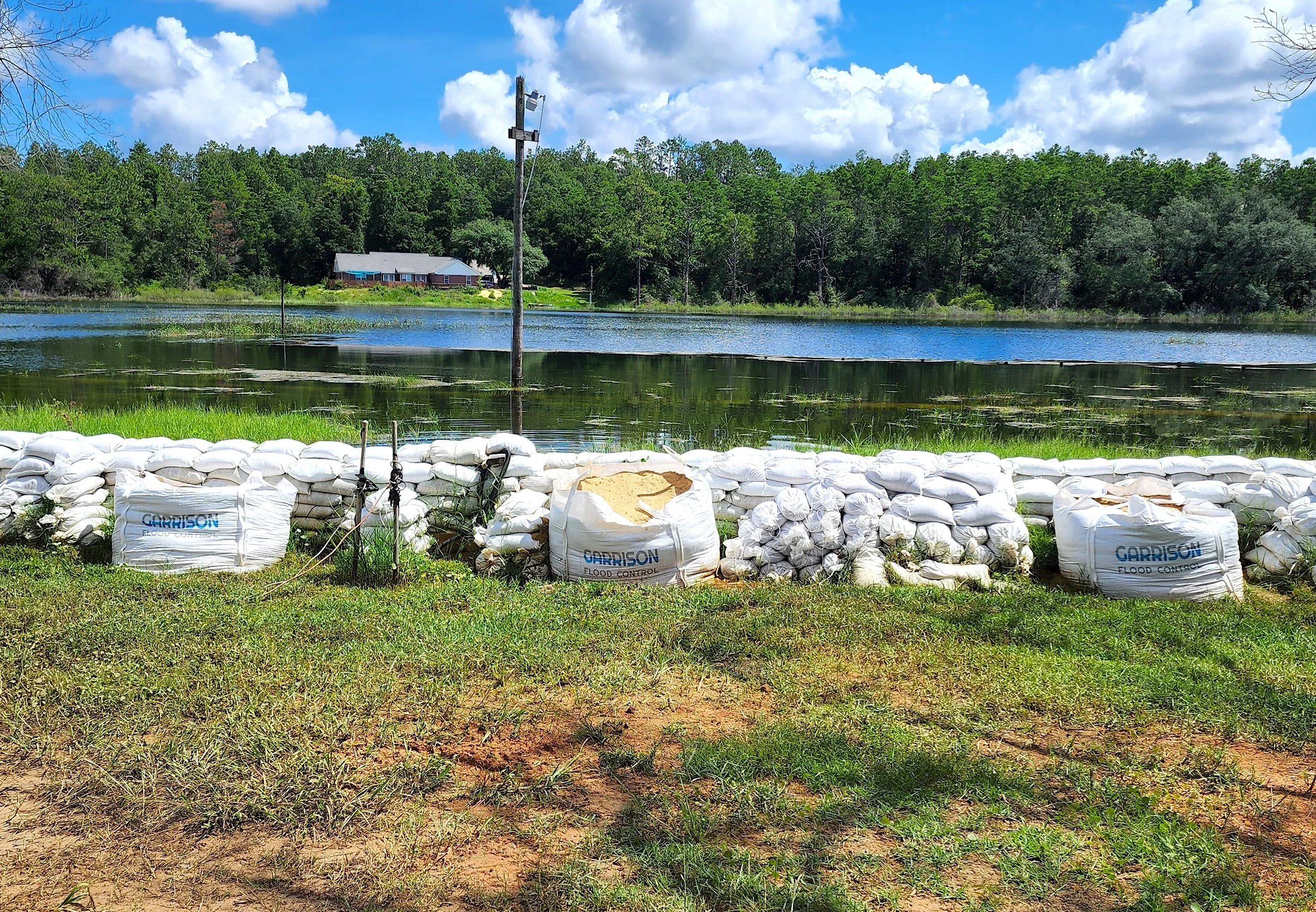 Sand filled flood barriers