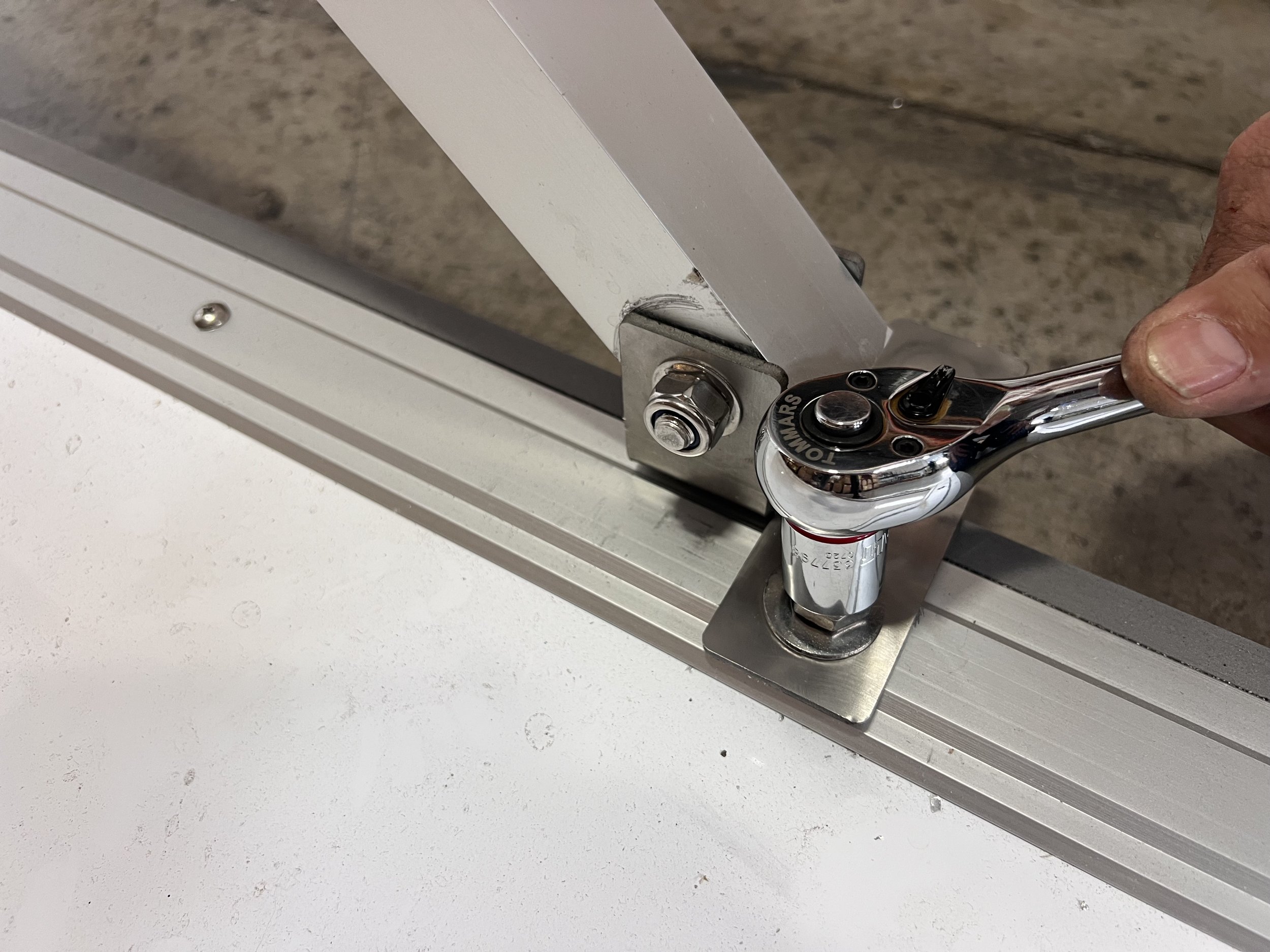Attaching flood wall support let