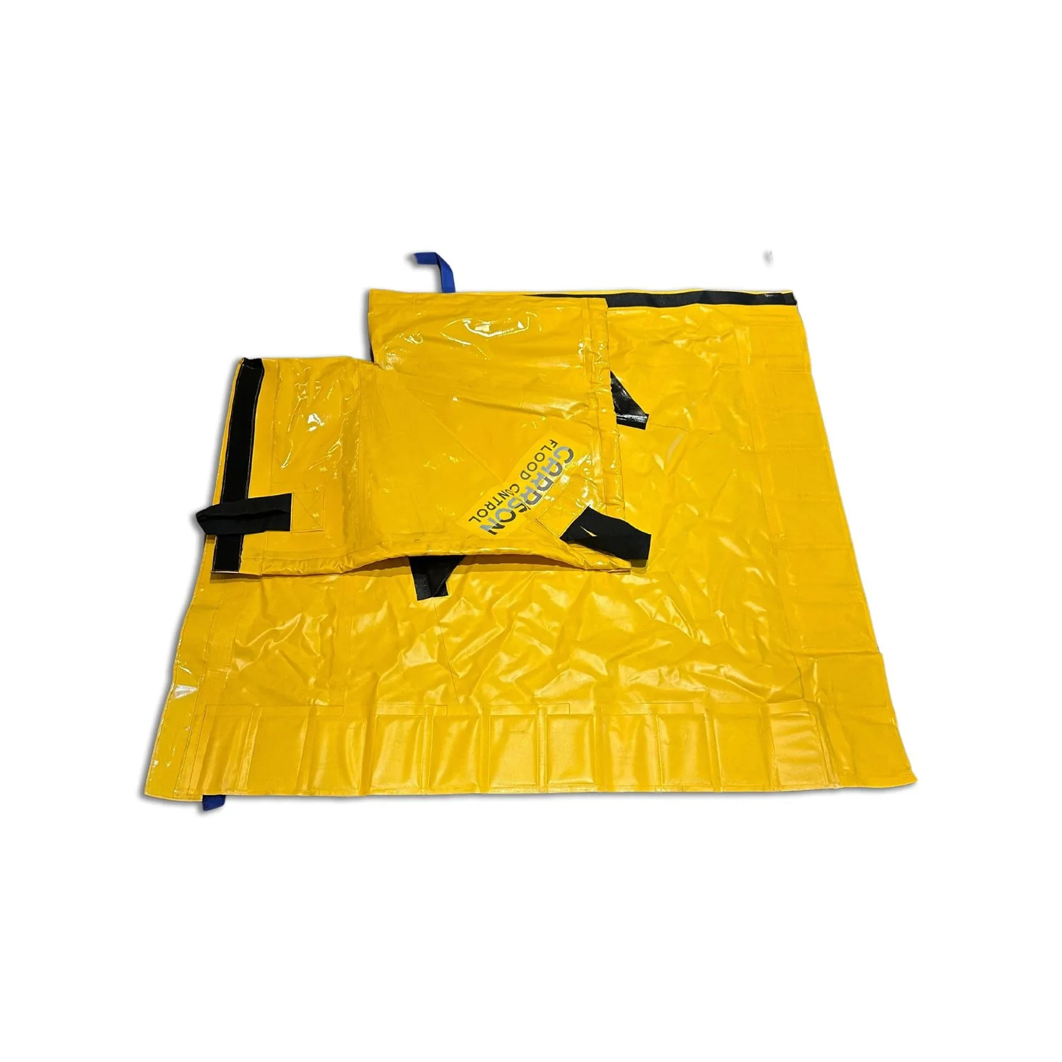Yellow flood barrier with black straps and a blue handle on a white background.